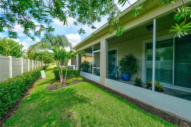 3681 Divot Ln, Sarasota, FL 34232 - view of yard featuring a sunroom