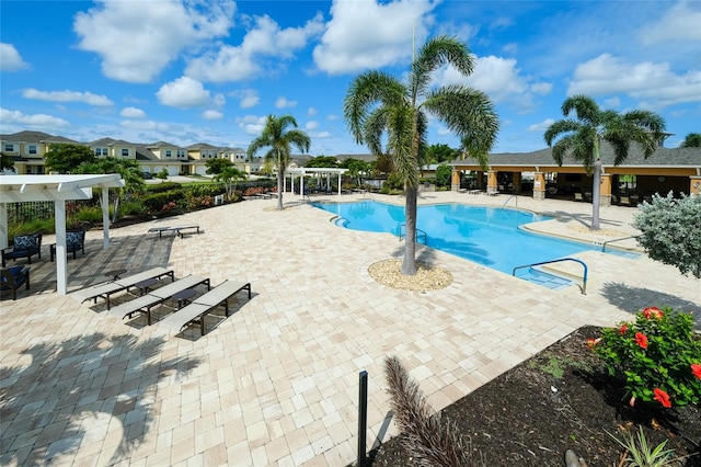 3681 Divot Ln, Sarasota, FL 34232 - community pool with a pergola and a patio