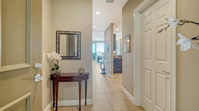 1771 Ringling Blvd Unit 1206, Sarasota, FL 34236 - corridor featuring light tile patterned flooring and baseboards