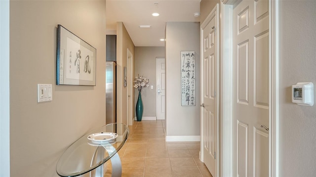1771 Ringling Blvd Unit 1206, Sarasota, FL 34236 - corridor featuring light tile patterned floors and baseboards