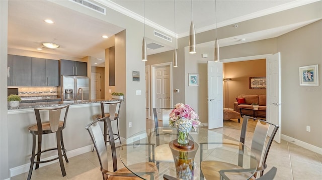 1771 Ringling Blvd Unit 1206, Sarasota, FL 34236 - dining area with ornamental molding, recessed lighting, and light tile patterned floors