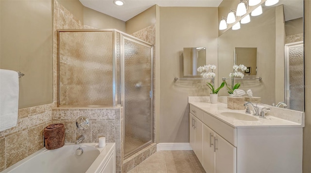 1771 Ringling Blvd Unit 1206, Sarasota, FL 34236 - full bathroom featuring vanity, a garden tub, a stall shower, and tile patterned floors