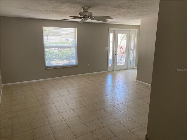 2131 Montclair Dr Unit 2131 & 2137, Sarasota, FL 34231 - spare room with a ceiling fan, tile patterned floors, and a textured ceiling