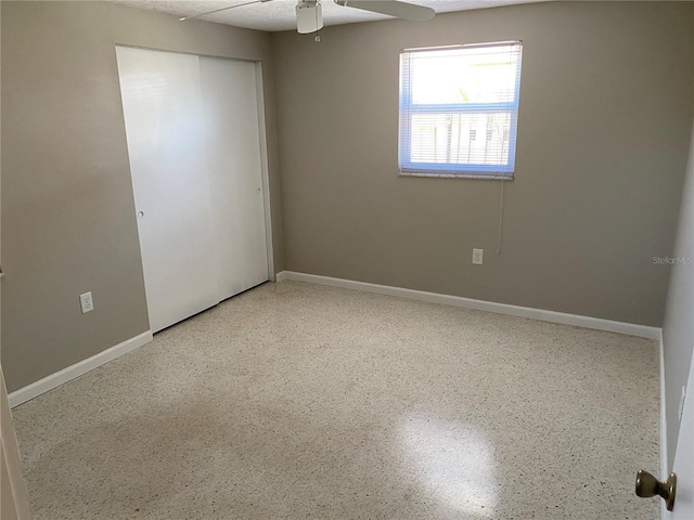 2131 Montclair Dr Unit 2131 & 2137, Sarasota, FL 34231 - unfurnished bedroom with speckle patterned floor, a closet, and ceiling fan