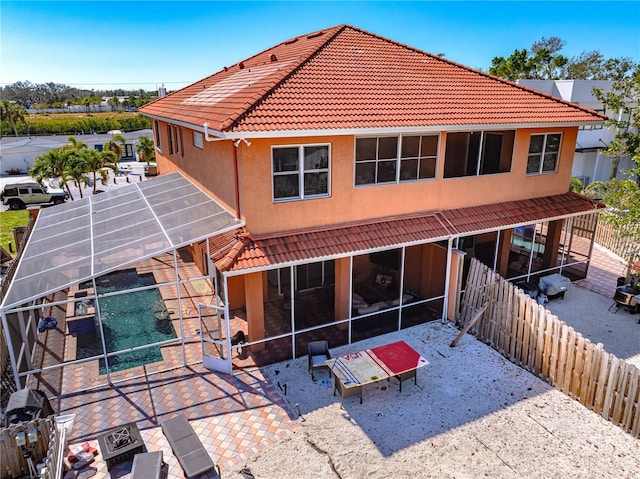 2119-2125 Montclair Dr Unit 2119 & 2125, Sarasota, FL 34231 - back of house with a tiled roof, a patio, a lanai, stucco siding, and a pool