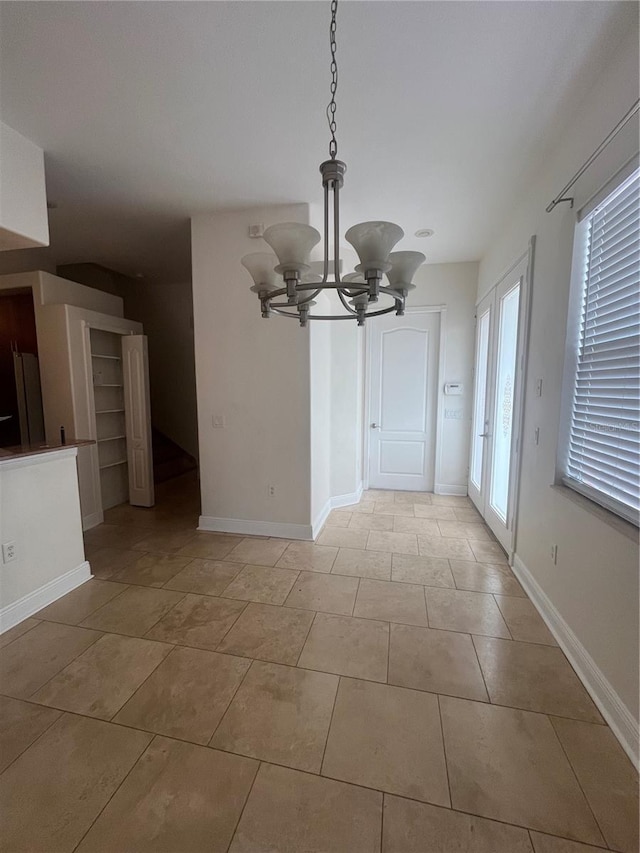 2119-2125 Montclair Dr Unit 2119 & 2125, Sarasota, FL 34231 - unfurnished dining area with a chandelier and light tile patterned floors