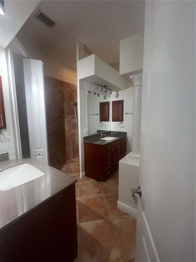 2119-2125 Montclair Dr Unit 2119 & 2125, Sarasota, FL 34231 - full bath with two vanities, a walk in shower, ornate columns, and tile patterned floors