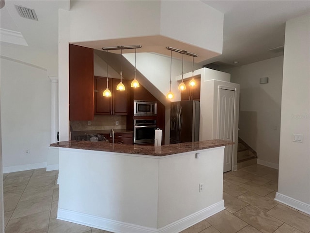 2119-2125 Montclair Dr Unit 2119 & 2125, Sarasota, FL 34231 - kitchen with stainless steel appliances, decorative backsplash, a peninsula, decorative light fixtures, and dark stone countertops
