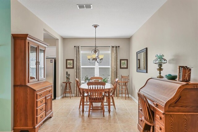 5333 Tide Point Way, Bradenton, FL 34208 - dining space with a chandelier, healthy amount of natural light, and light tile patterned flooring