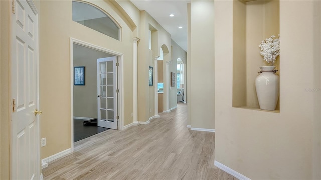 7717 US Open Loop, Lakewood Ranch, FL 34202 - hall with arched walkways, wood finished floors, and recessed lighting