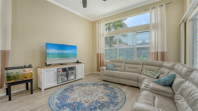 7717 US Open Loop, Lakewood Ranch, FL 34202 - living room featuring crown molding, a ceiling fan, and light wood-style floors
