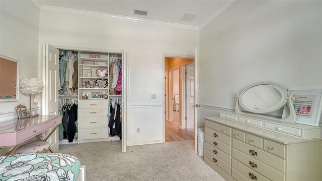 7717 US Open Loop, Lakewood Ranch, FL 34202 - bedroom featuring ornamental molding, a closet, and light carpet