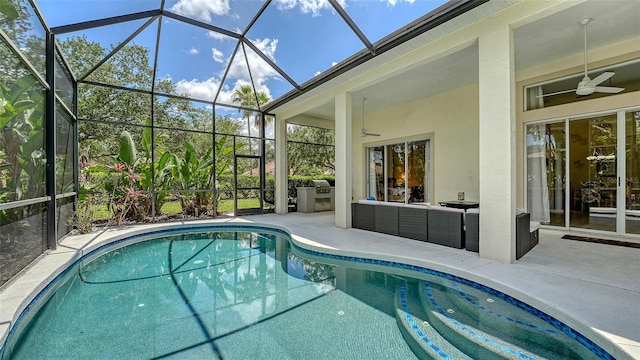 7717 US Open Loop, Lakewood Ranch, FL 34202 - outdoor pool featuring a ceiling fan, a patio, glass enclosure, outdoor lounge area, and area for grilling