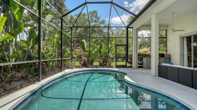 7717 US Open Loop, Lakewood Ranch, FL 34202 - outdoor pool featuring a patio, ceiling fan, and a lanai