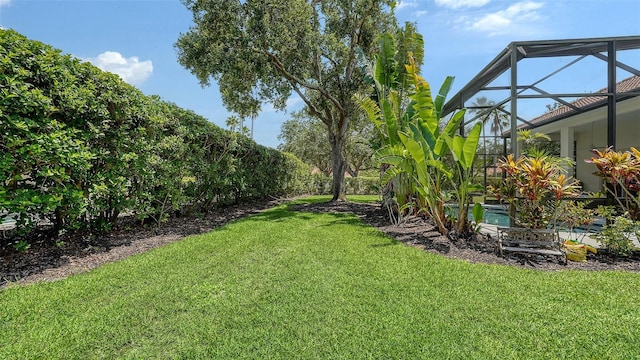 7717 US Open Loop, Lakewood Ranch, FL 34202 - view of grassy yard featuring glass enclosure and an outdoor pool