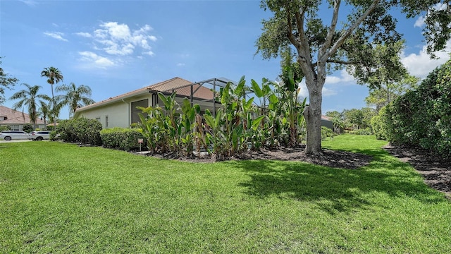 7717 US Open Loop, Lakewood Ranch, FL 34202 - view of grassy yard with glass enclosure