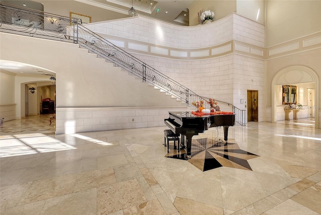 7717 US Open Loop, Lakewood Ranch, FL 34202 - building lobby with a high ceiling, ornamental molding, and a wainscoted wall