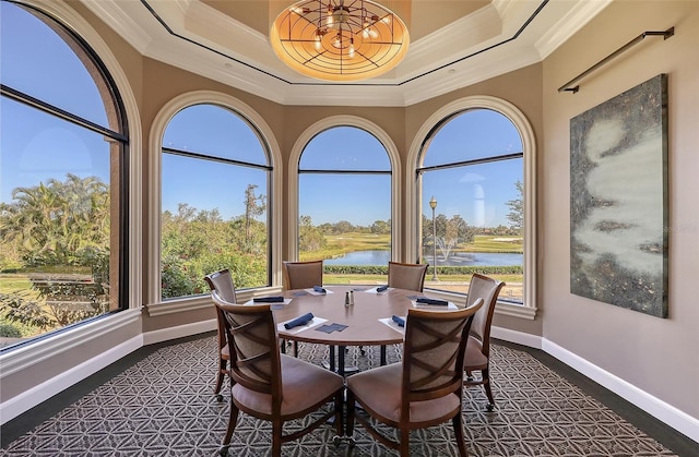 7717 US Open Loop, Lakewood Ranch, FL 34202 - dining space with ornamental molding, a water view, a tray ceiling, and plenty of natural light