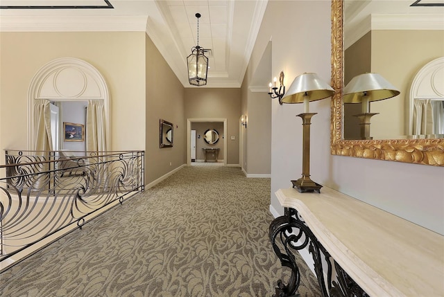 7717 US Open Loop, Lakewood Ranch, FL 34202 - hallway featuring carpet floors, ornamental molding, and a tray ceiling