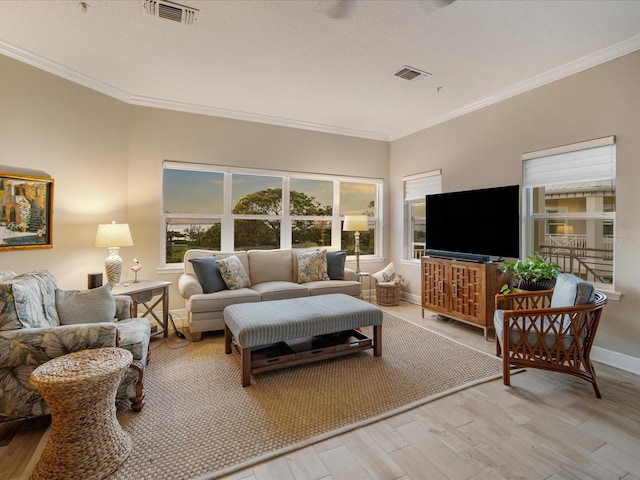 7840 34th Ave W Unit 303, Bradenton, FL 34209 - living room with light wood-style floors and crown molding