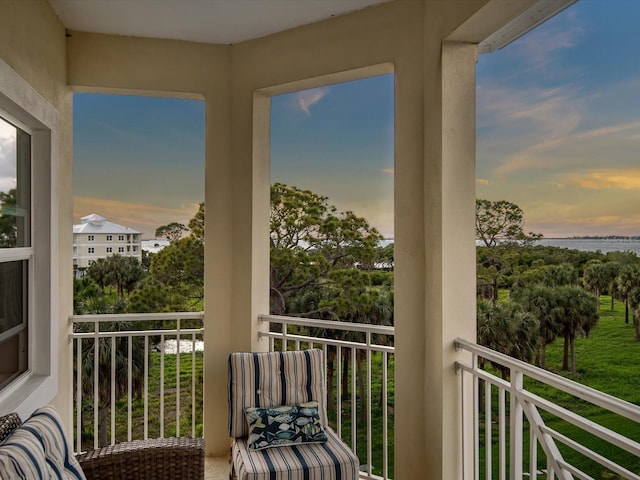 7840 34th Ave W Unit 303, Bradenton, FL 34209 - balcony at dusk featuring a water view