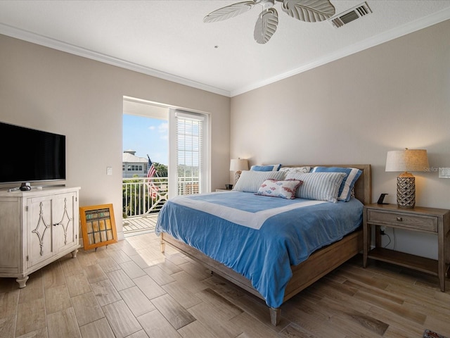 7840 34th Ave W Unit 303, Bradenton, FL 34209 - bedroom featuring access to outside, crown molding, and wood finished floors
