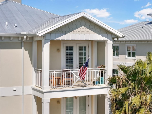 7840 34th Ave W Unit 303, Bradenton, FL 34209 - property entrance with a metal roof, a balcony, and stucco siding
