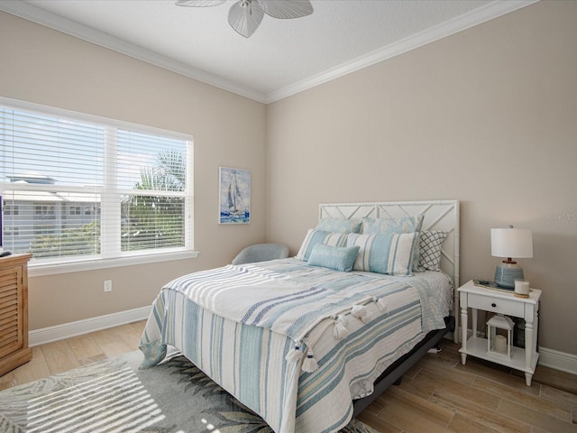 7840 34th Ave W Unit 303, Bradenton, FL 34209 - bedroom featuring wood finished floors, crown molding, and a ceiling fan
