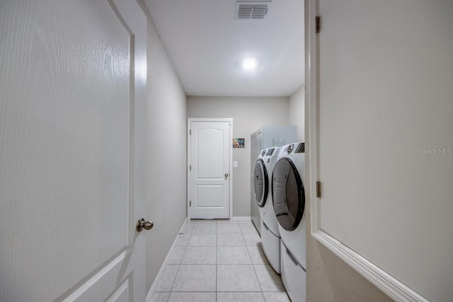 640 Encarnacion St, Punta Gorda, FL 33983 - laundry room with washing machine and clothes dryer and light tile patterned flooring