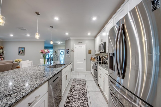 640 Encarnacion St, Punta Gorda, FL 33983 - kitchen featuring appliances with stainless steel finishes, ornamental molding, recessed lighting, white cabinetry, and decorative light fixtures