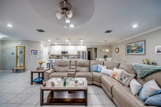 640 Encarnacion St, Punta Gorda, FL 33983 - living room with a ceiling fan, ornamental molding, recessed lighting, light tile patterned floors, and a chandelier
