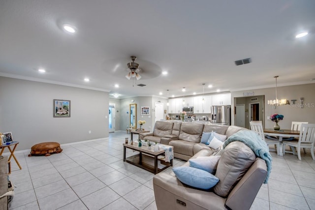 640 Encarnacion St, Punta Gorda, FL 33983 - living area with light tile patterned floors, recessed lighting, crown molding, a chandelier, and a ceiling fan