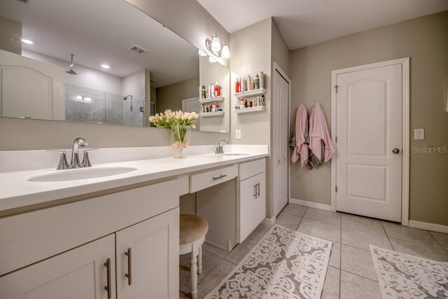 640 Encarnacion St, Punta Gorda, FL 33983 - full bathroom featuring double vanity, tiled shower, and tile patterned floors