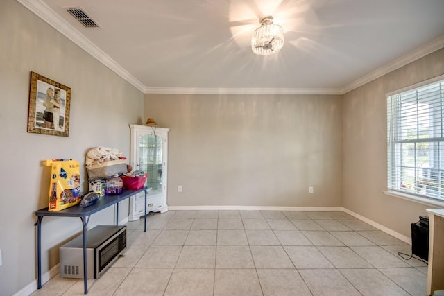 640 Encarnacion St, Punta Gorda, FL 33983 - unfurnished room with plenty of natural light, crown molding, and light tile patterned flooring