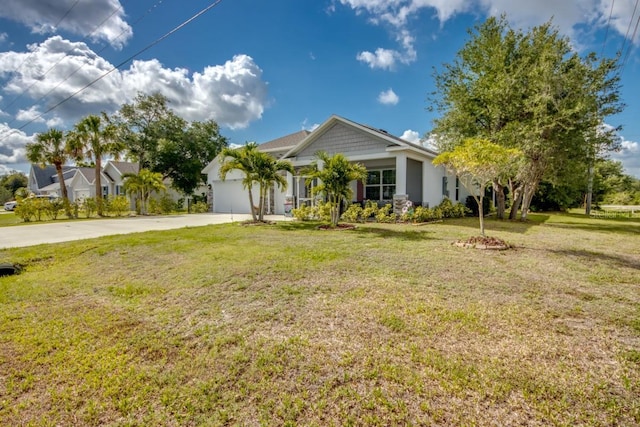 640 Encarnacion St, Punta Gorda, FL 33983 - view of front of house with concrete driveway, a front yard, and a garage