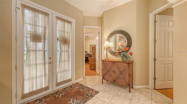 7012 Treymore Ct, Sarasota, FL 34243 - foyer featuring french doors and tile patterned flooring