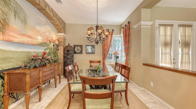 7012 Treymore Ct, Sarasota, FL 34243 - dining room featuring a chandelier and light tile patterned flooring
