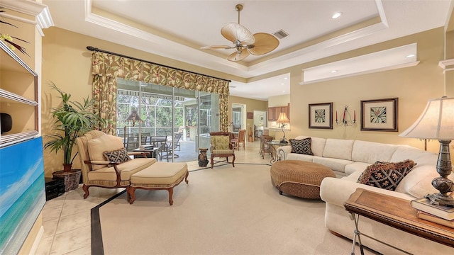 7012 Treymore Ct, Sarasota, FL 34243 - living area featuring a tray ceiling, ceiling fan, crown molding, recessed lighting, and tile patterned flooring