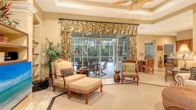 7012 Treymore Ct, Sarasota, FL 34243 - sitting room featuring ceiling fan, ornamental molding, a raised ceiling, and tile patterned floors