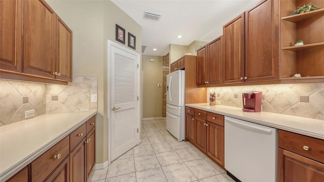 7012 Treymore Ct, Sarasota, FL 34243 - kitchen with white appliances, open shelves, light countertops, brown cabinets, and recessed lighting