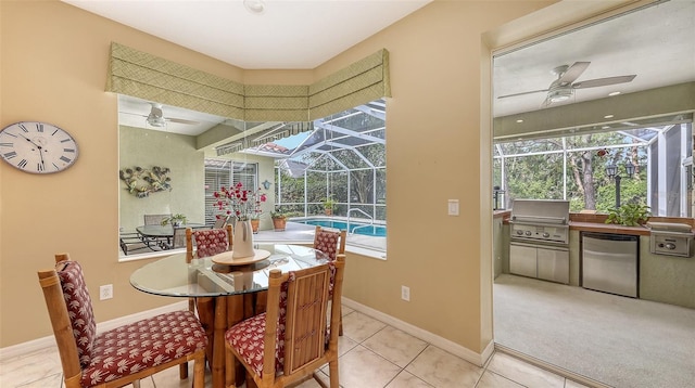 7012 Treymore Ct, Sarasota, FL 34243 - tiled dining space with a sunroom, ceiling fan, and healthy amount of natural light
