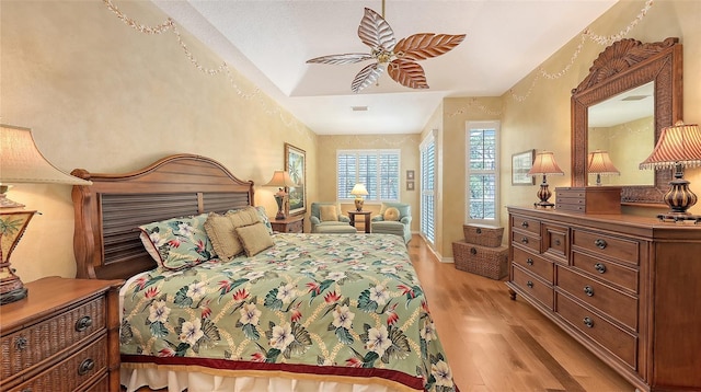 7012 Treymore Ct, Sarasota, FL 34243 - bedroom featuring light wood finished floors and a ceiling fan
