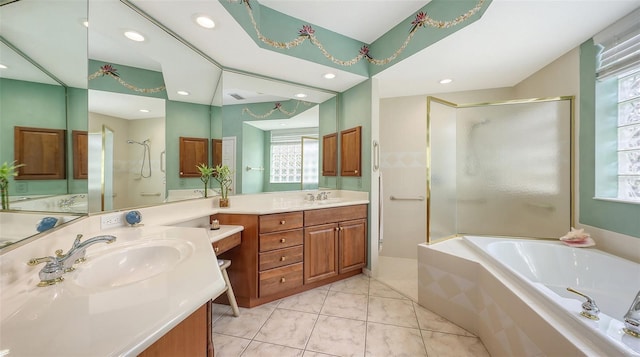7012 Treymore Ct, Sarasota, FL 34243 - bathroom with a bath, double vanity, a stall shower, recessed lighting, and tile patterned floors
