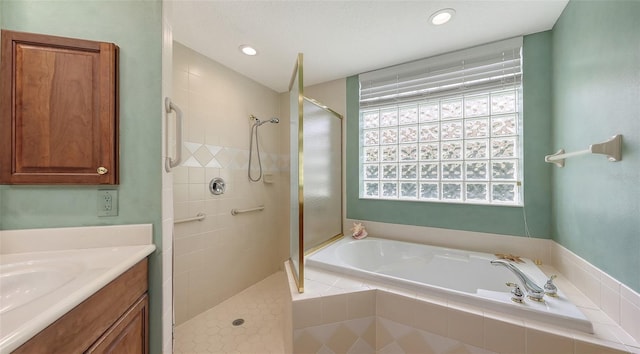7012 Treymore Ct, Sarasota, FL 34243 - bathroom with a garden tub, a tile shower, vanity, and recessed lighting