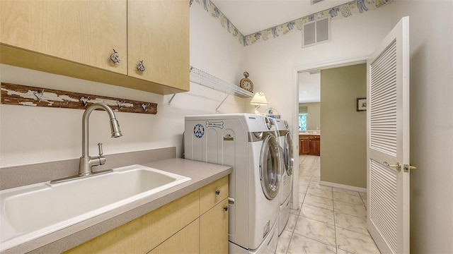 7012 Treymore Ct, Sarasota, FL 34243 - laundry room with washing machine and dryer and cabinet space