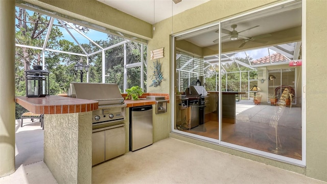 7012 Treymore Ct, Sarasota, FL 34243 - view of patio featuring an outdoor kitchen, a lanai, and ceiling fan