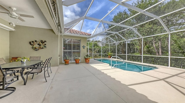 7012 Treymore Ct, Sarasota, FL 34243 - swimming pool featuring a patio area, a ceiling fan, outdoor dining area, and a lanai