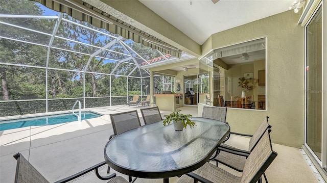 7012 Treymore Ct, Sarasota, FL 34243 - swimming pool featuring a patio area, outdoor dining area, and glass enclosure