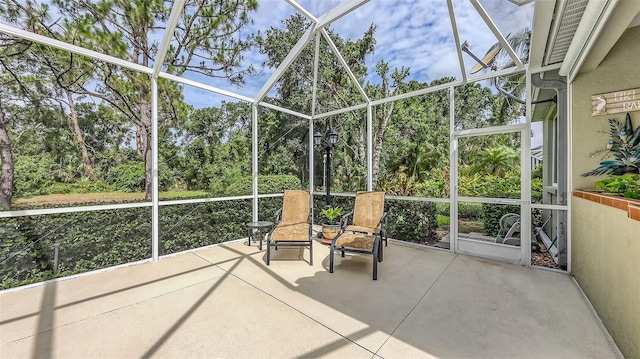 7012 Treymore Ct, Sarasota, FL 34243 - unfurnished sunroom featuring view of scattered trees