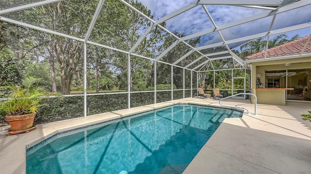 7012 Treymore Ct, Sarasota, FL 34243 - swimming pool with a patio area and glass enclosure